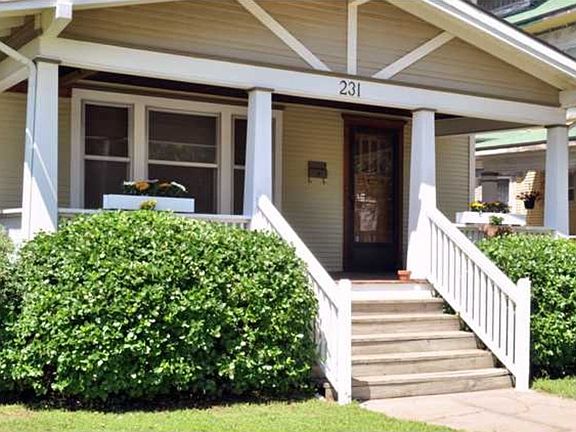 A large, covered front porch perfect for relaxing