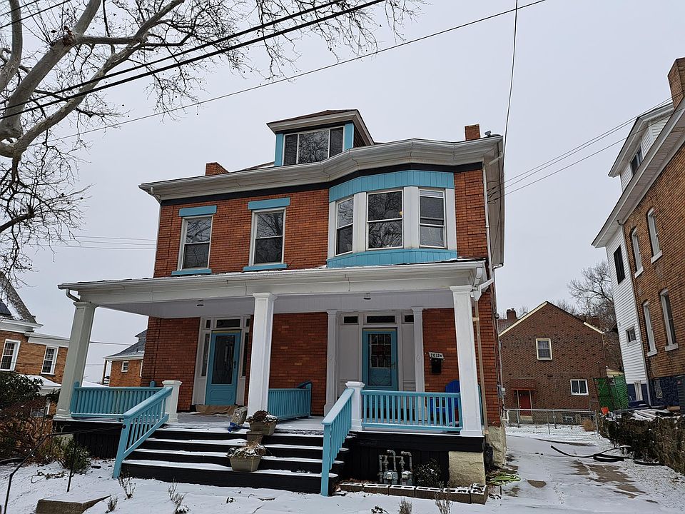 It's the brick house with the blue trim!