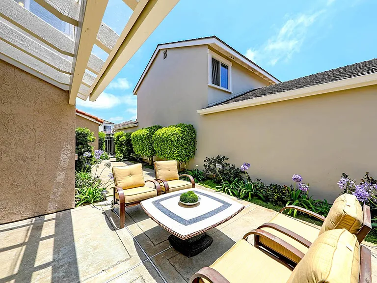 Patio yard with lockable gates at each end of yard.
