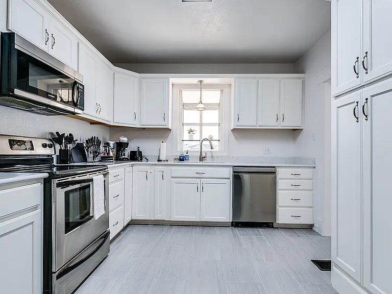 Fully stocked kitchen with stainless steel appliances