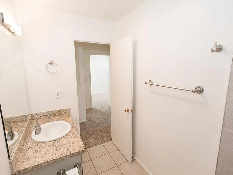 Second bathroom. Granite counter top and LED lighting
