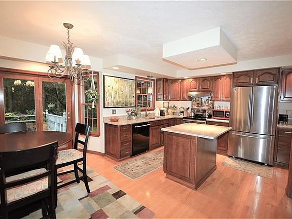 Spacious Eat-in Kitchen with Island, pantry and French Door leading to the deck!