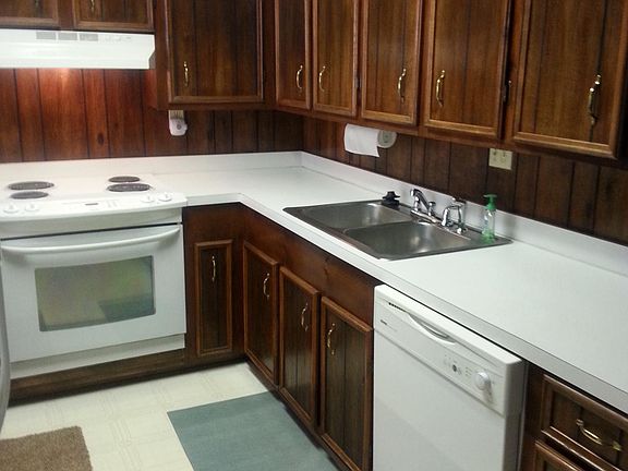 Kitchen  with appliance and its divided between the dinning 