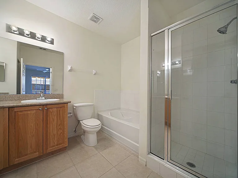 Primary bathroom w/ shower enclosure, soaking tun & dual vanity