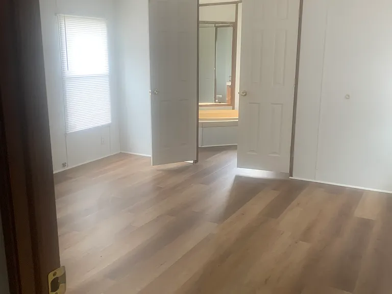 large master bedroom looking into the master bedroom bath