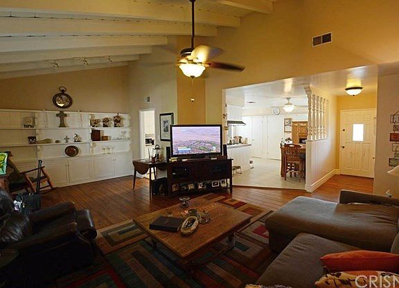 Living room with view into the kitchen.