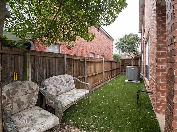 Formal dining room has custom inlaid design for a dramatic effect.