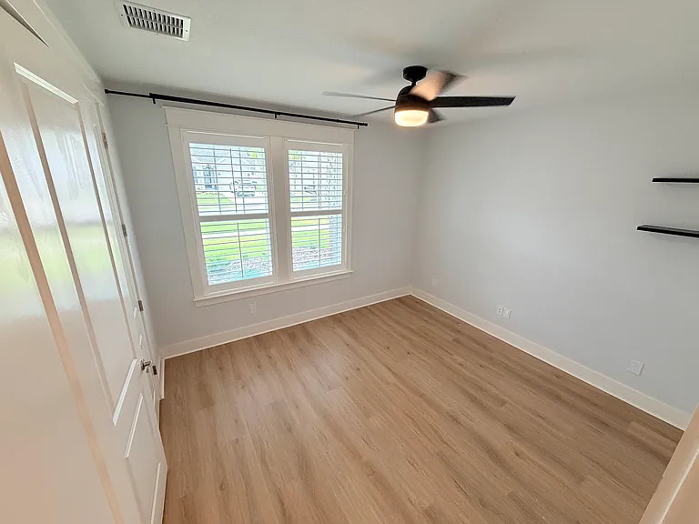 Bedroom 4 with front-of-home views and natural light
