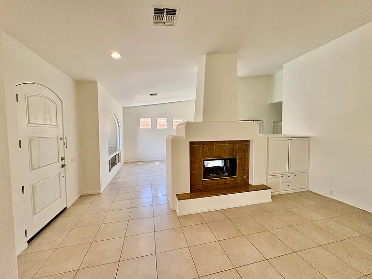 FRONT ENTRY, DOUBLE SIDED GAS FIREPLACE, MEDIA CABINET