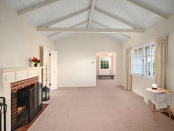 Front living room. Opens to formal dining room/office.