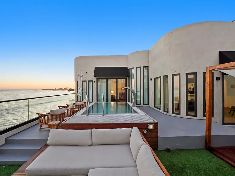 Soft lighting, ocean views, and spacious sofas _ all you need to relax.