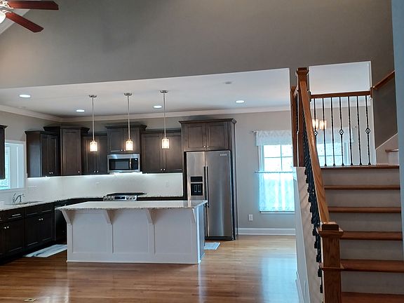 Real Oak wood floors are beautiful. Upgraded granite counters. Upgraded gas range. Upgraded Refrigerator.