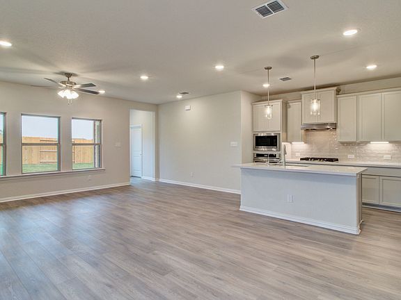 Living Open to Kitchen and Dining