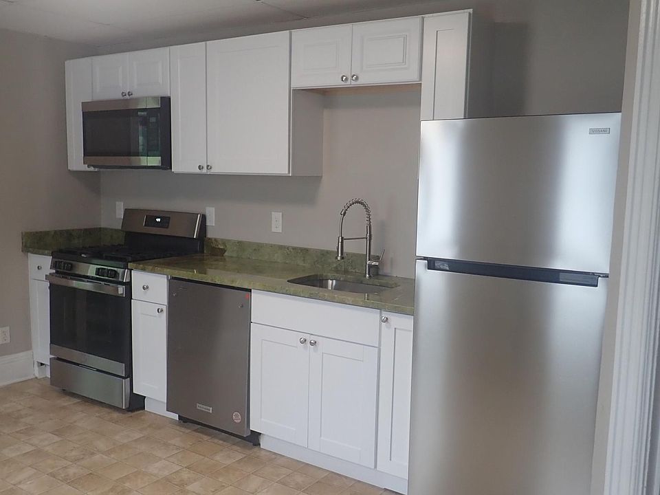 Newly renovated kitchen: stainless steel appliances and granite countertop