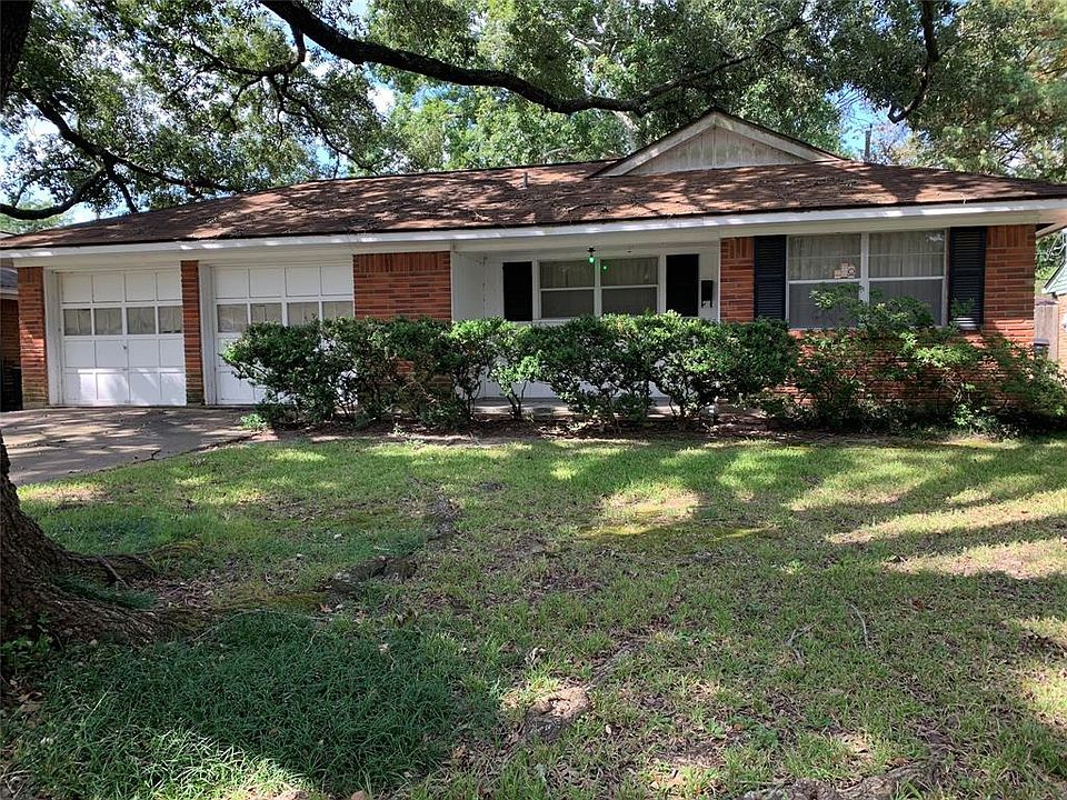 Charming brick home waiting for your updates. Great floor plan. Lots of potential.