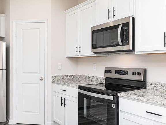 Each kitchen includes stainless-steel appliances