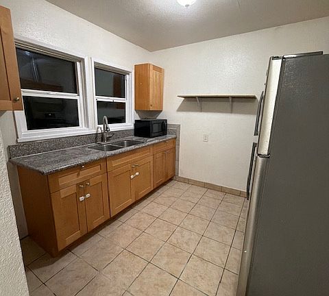 kitchen with stove and refrigarator