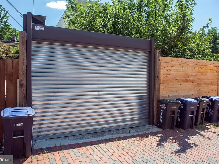 Garage door. Trash pickup in alley.