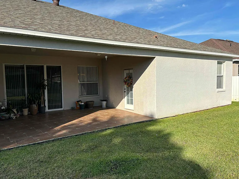 Tiled and covered back patio