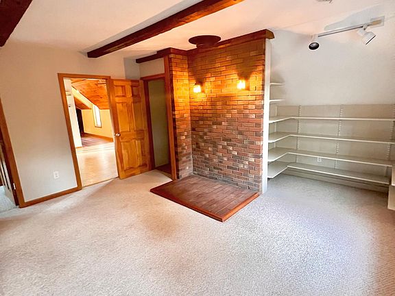 Living Room with two (2) walk in closets and built-in shelving