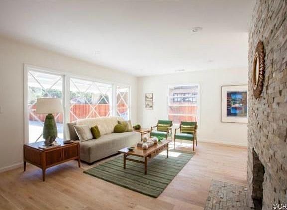 The front living room with its original, diamond-light window, a
