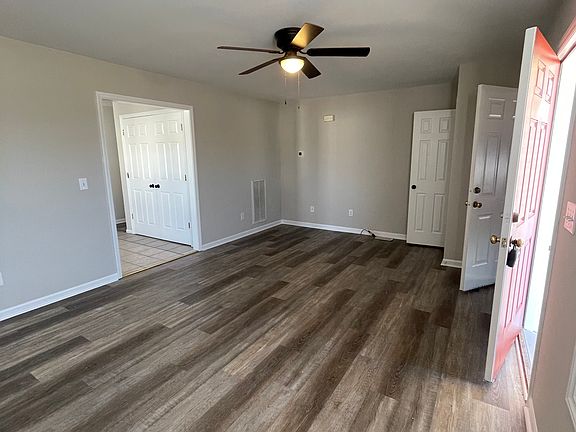 Living room w/ coat closet