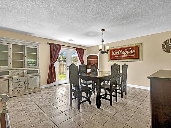 Home features central electric, ceiling fans, combination tile and carpet flooring.