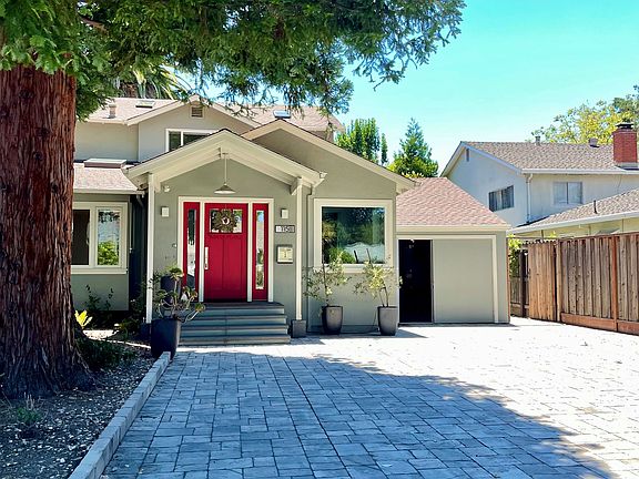 Beautiful redwood trees keep property cool, with large driveway and 1-car garage to the right