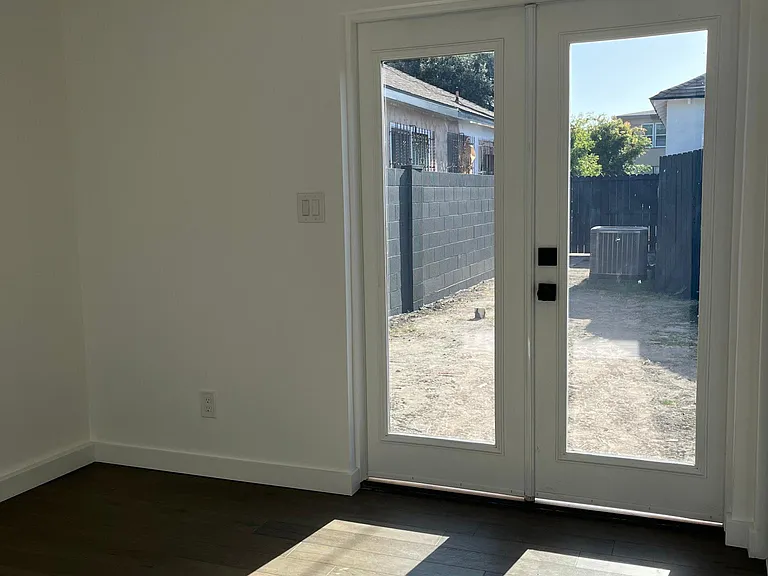 1st bedroom with french doors to exterior