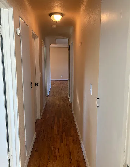 Hallway from Bedroom 3 towards living room. Bedroom 3 is the biggest, same type of closet as bedroom 2. I cannot find the picture. Sorry about that! Bedroom 1 and 2 share walls with bedroom 3.