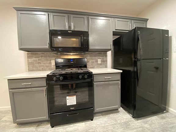 New oven, refrigerator and refinished cabinets