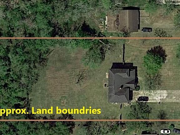 No Survey- Buyer acquires if needed. Back portion of this nearly 1 Acre property is wooded.