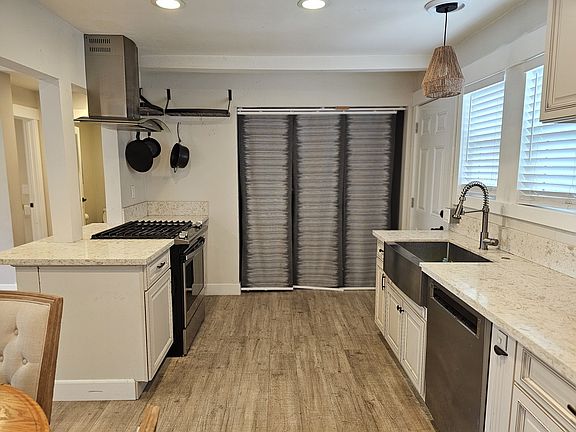 Kitchen, laundry hook up behind the curtain