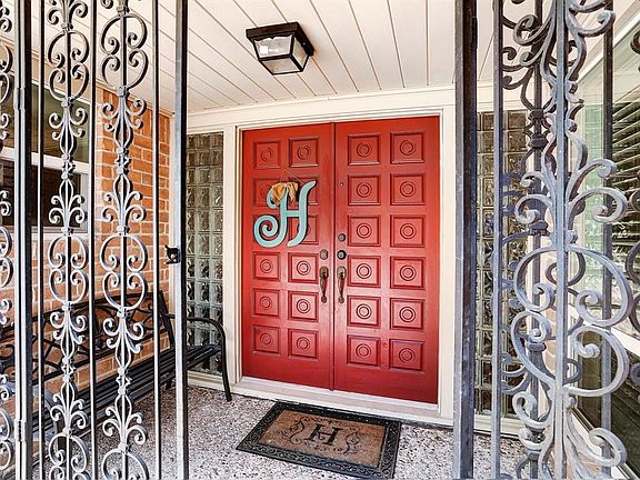 Enter through the gated entry to the elegant double doors which welcome you into this stunning home!