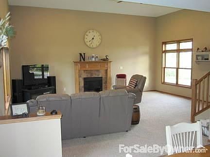 Great Room : 16' vaulted ceiling, fireplace and many windows with a nice view of the woods.