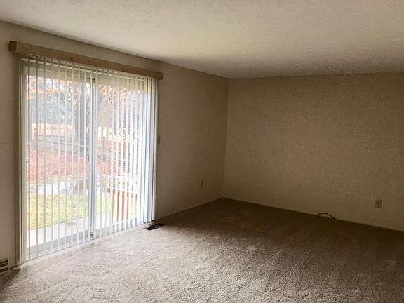 Living room with small deck outside of patio doors.