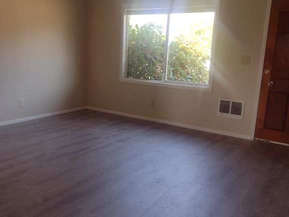 Living room, picture taken from kitchen facing front door