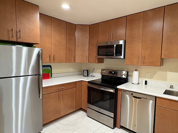 Full kitchen with stainless steel appliances