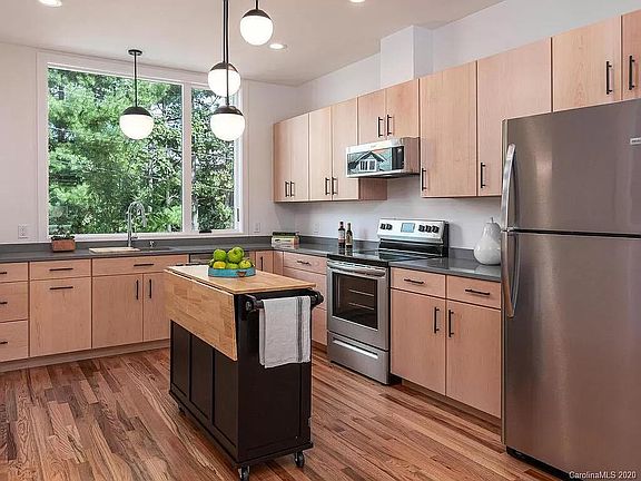 Custom kitchen with quartz counters (stand alone island not included)