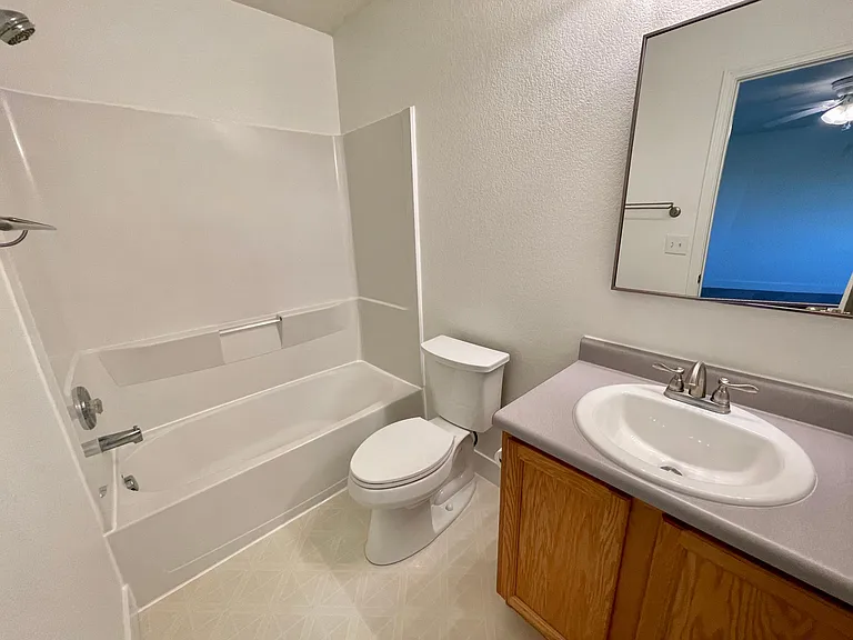 Ensuite master bathroom with brand new toilet, sink, and faucet