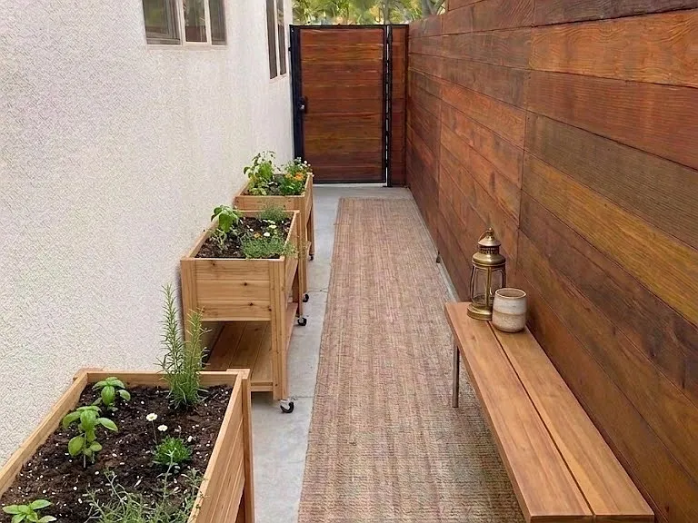 The side entrance and walkway, another private space just for this side of the duplex that wraps around to the back patio area (Virtual Staging)