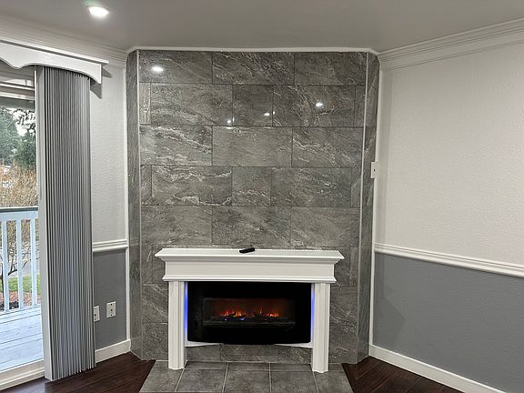 Cozy electric fireplace + feature wall!