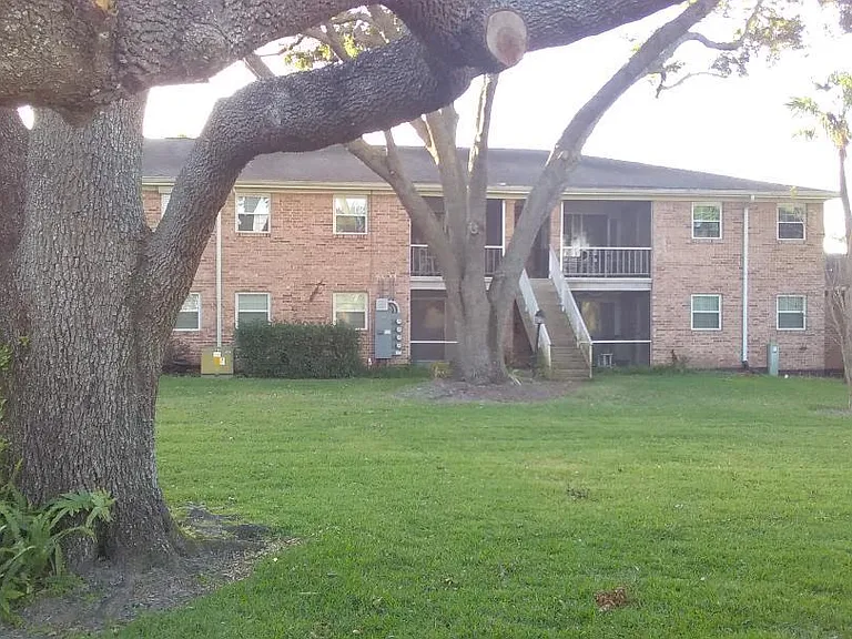 Secluded grassy and wooded courtyard