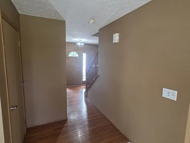 First floor hallway looking toward front door
