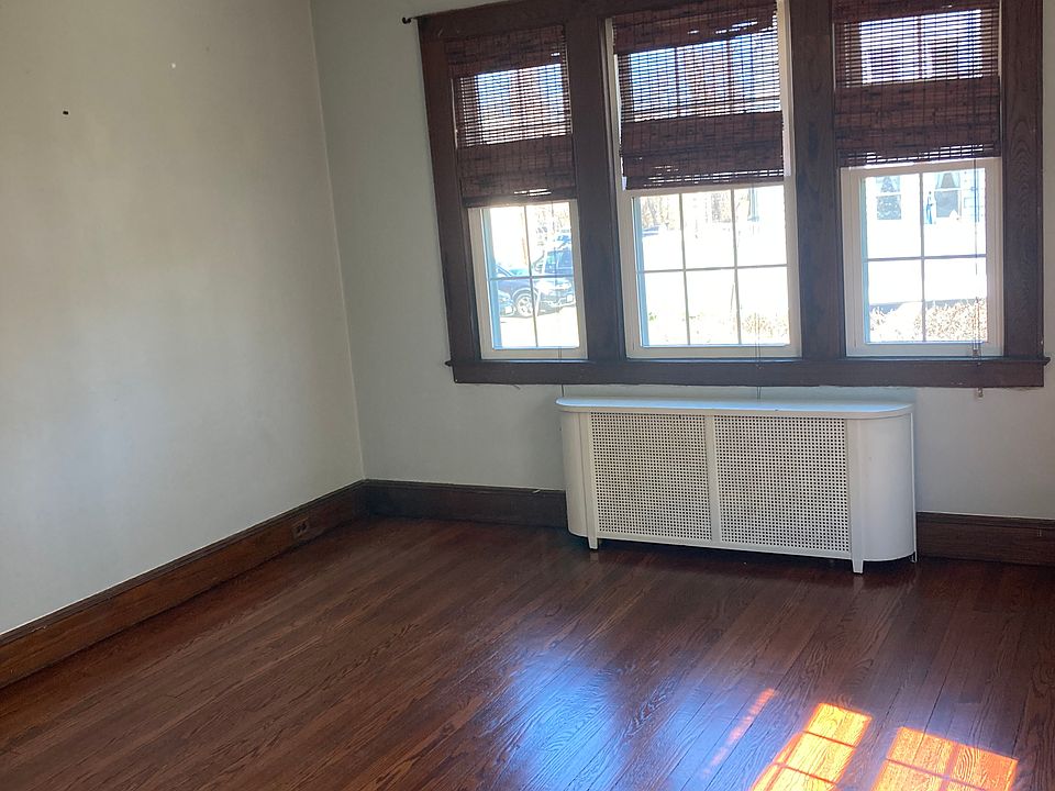 Spacious and Bright Living Room with Hardwood floors and ceiling fan