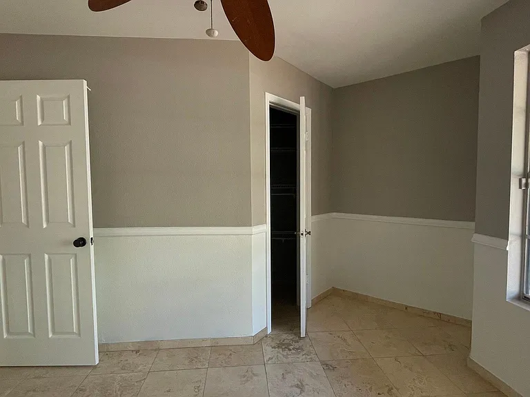 UNFURNISHED. 1st. Guestroom. Fits a queen size bed, features a walk-in closer. Room for a desk/chair.