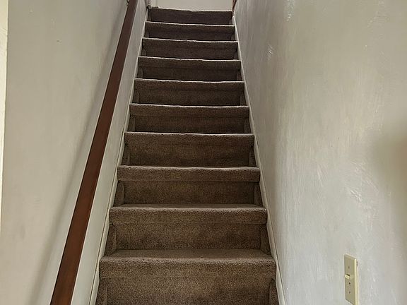 stairs to (2) bedrooms up and play room