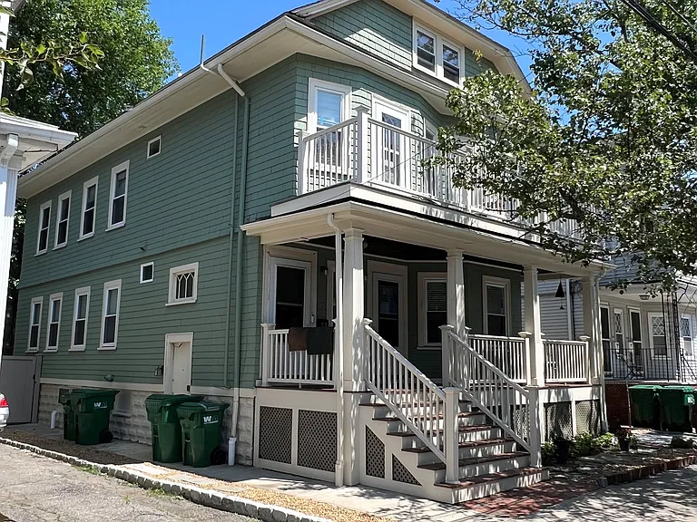 View of 62 Bristol Rd. with entry porch and 2nd floor shared deck.