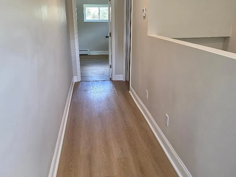 2nd view of 2nd floor hallway, bedroom at the end of hallway, 2nd floor bathroom on the right