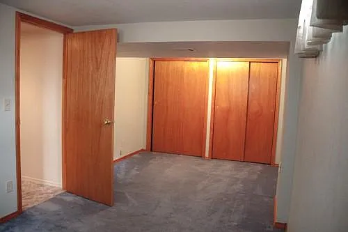 One end of the long basement bedroom.